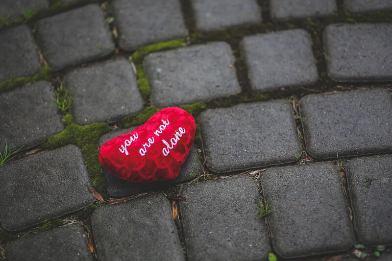 you are not alone heart on pavement