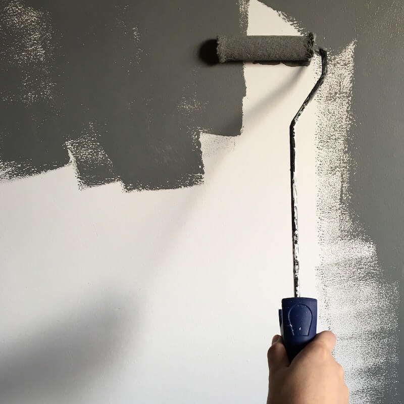 Paint roller with grey paint