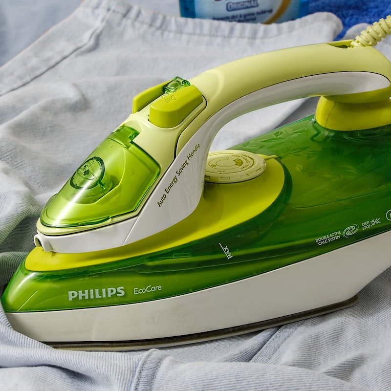 Green philips iron ironing blue shirt