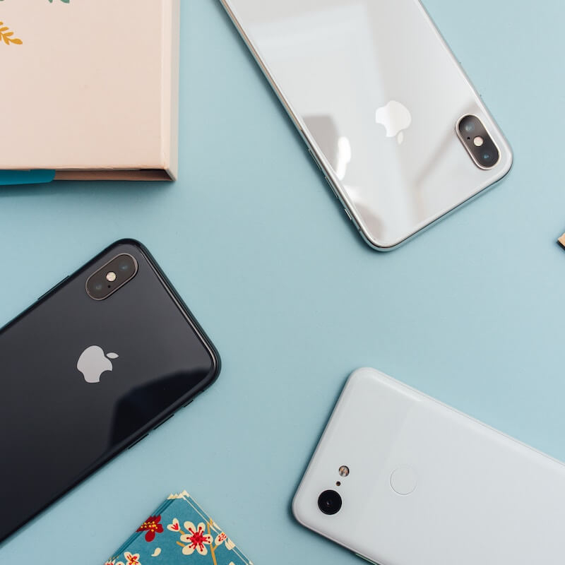 White Google Pixel 3 next to Black iPhone Xs and White iPhone Xr