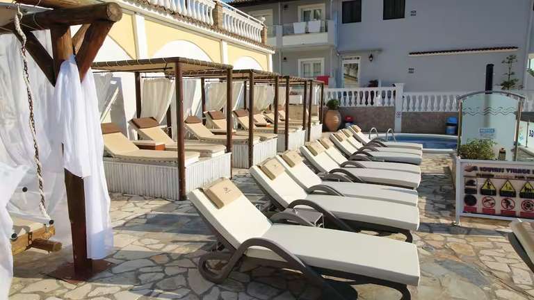 Loulass Village Hotel, Corfu - 2 Adults for 7 nights (5/5 Tripadvisor) TUI Gatwick Flights +20kg Suitcases +10kg Bags +Transfers - 17th May